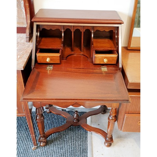 419 - A mahogany bureau with pigeon hole interior and two drawers under, height 38