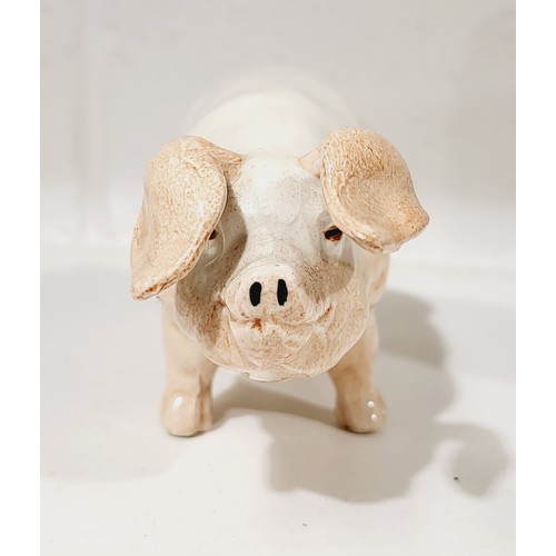 352 - An Excalibur ceramic model of a pig, length 6.5