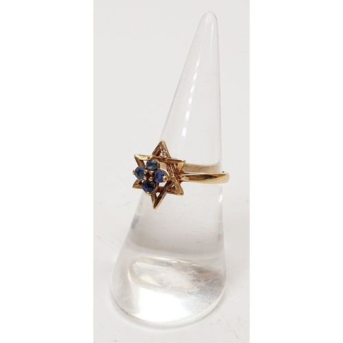 16 - A 1970s hallmarked 9ct gold ring set with sapphires, size L, gross weight 2.4g. UK shipping £14.