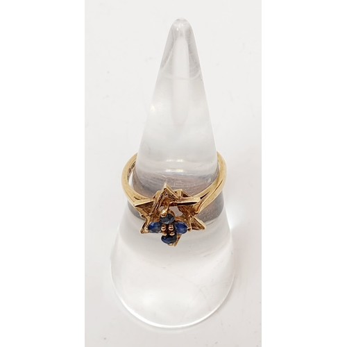 16 - A 1970s hallmarked 9ct gold ring set with sapphires, size L, gross weight 2.4g. UK shipping £14.