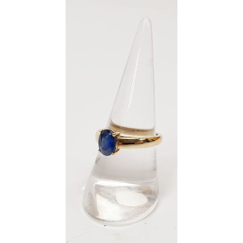 21 - A hallmarked 9ct gold ring set with a sapphire, size P, gross weight 2.4g. UK shipping £14.