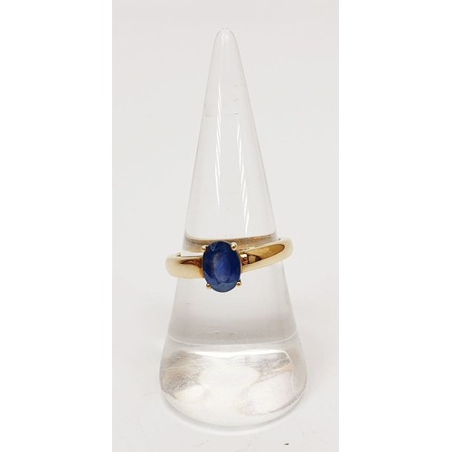 21 - A hallmarked 9ct gold ring set with a sapphire, size P, gross weight 2.4g. UK shipping £14.