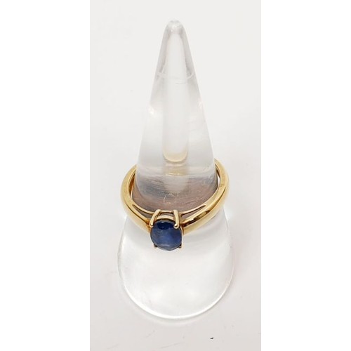 21 - A hallmarked 9ct gold ring set with a sapphire, size P, gross weight 2.4g. UK shipping £14.