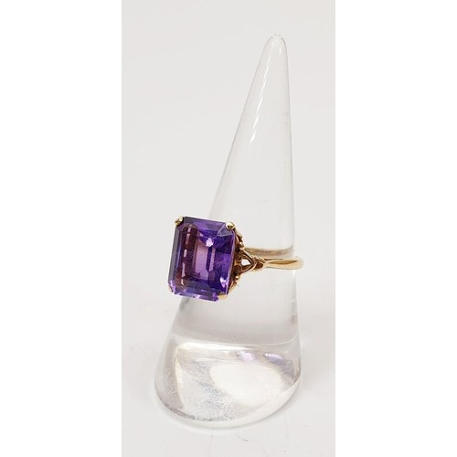 24 - A 9ct gold ring set with an amethyst, size O, gross weight 3.2g. UK shipping £14.