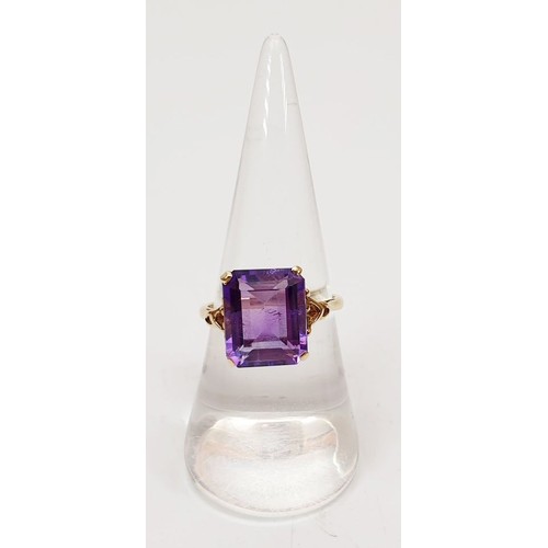 24 - A 9ct gold ring set with an amethyst, size O, gross weight 3.2g. UK shipping £14.