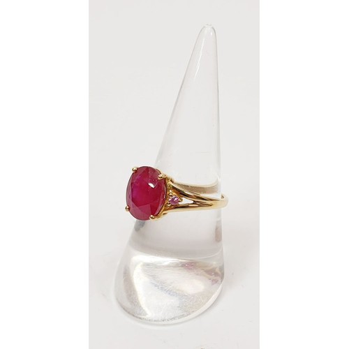 26 - A hallmarked 9ct gold ring set with ruby and pink sapphire, size N, gross weight 3.34g. UK shipping ... 