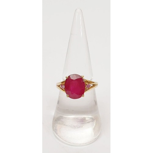 26 - A hallmarked 9ct gold ring set with ruby and pink sapphire, size N, gross weight 3.34g. UK shipping ... 