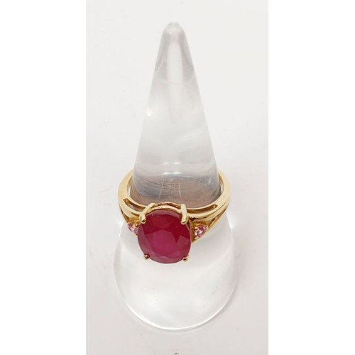 26 - A hallmarked 9ct gold ring set with ruby and pink sapphire, size N, gross weight 3.34g. UK shipping ... 