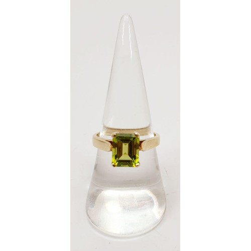 27 - A hallmarked 9ct gold ring set with peridot, size N/O, gross weight 3.7g. UK shipping £14.