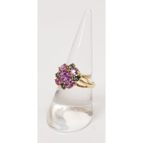 28 - A hallmarked 9ct gold ring set with amethyst and tourmaline, size O, gross weight 3.4g. UK shipping ... 