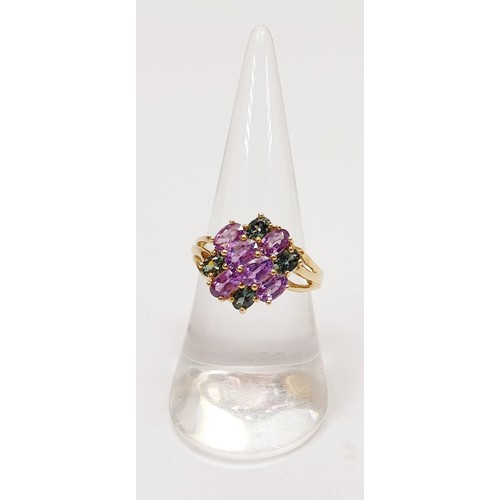 28 - A hallmarked 9ct gold ring set with amethyst and tourmaline, size O, gross weight 3.4g. UK shipping ... 