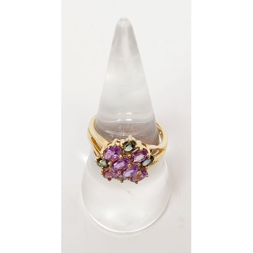 28 - A hallmarked 9ct gold ring set with amethyst and tourmaline, size O, gross weight 3.4g. UK shipping ... 