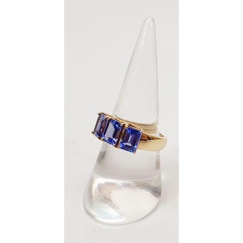 30 - A hallmarked 9ct gold ring set with tanzanite, size O, gross weight 3.4g. UK shipping £14.