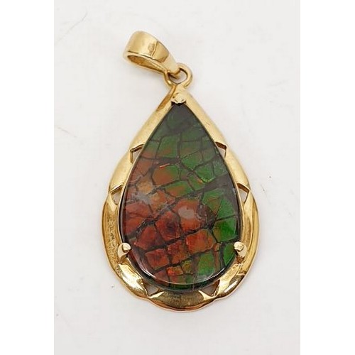 46 - A hallmarked 14ct gold pendant set with ammolite, length 1.25