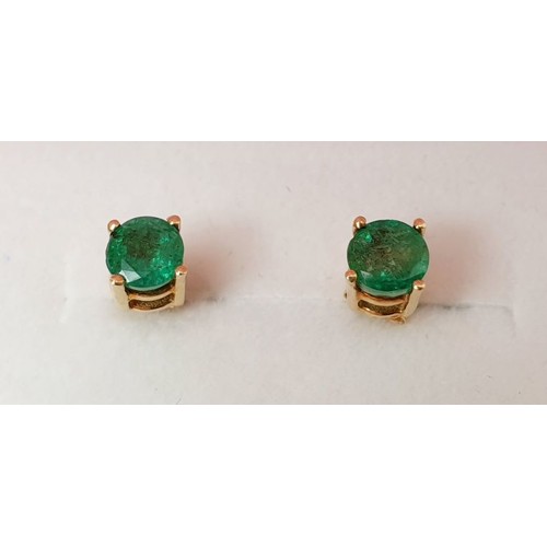 48 - A pair of 9ct gold earrings set with emerald. UK shipping £14.