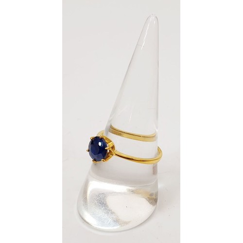 56 - A gold plated silver ring set with a sapphire, size P. UK shipping £14.