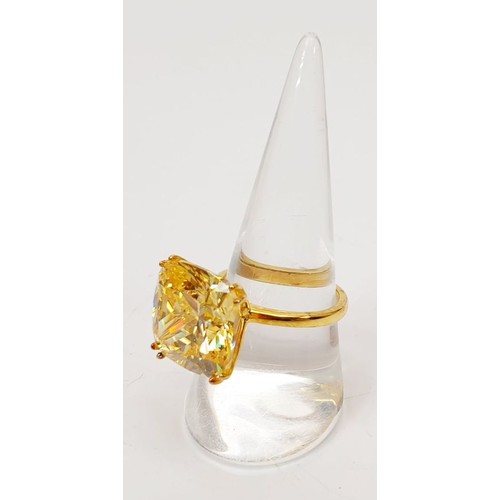 57 - A gold plated silver ring set with a simulated canary diamond, size P/Q. UK shipping £14.