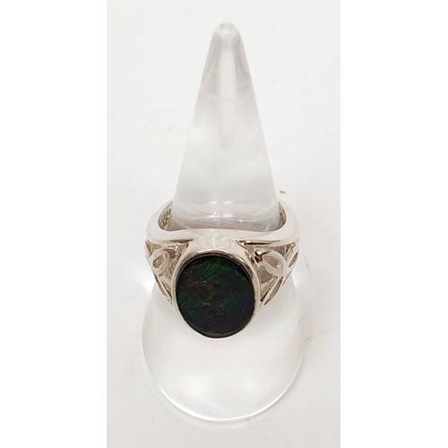 60 - A silver ring set with ammolite, size N/O. UK shipping £14.