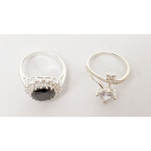 67 - Two silver rings set with coloured stones, both size Q. UK shipping £14.