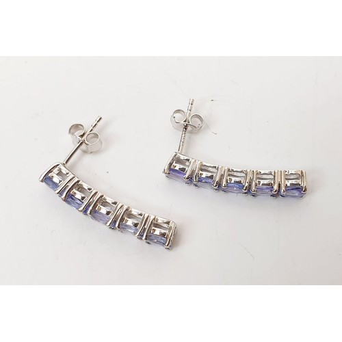 77 - A pair of silver earrings set with tanzanite. UK shipping £14.