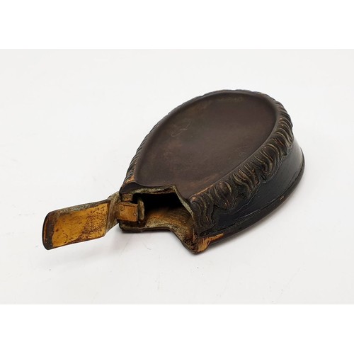 89 - An antique vesta case in the form of a horse shoe, length 2.25