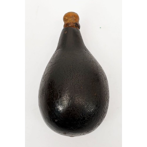 99 - An antique wooden lacquered pear shaped bottle, length 3.5