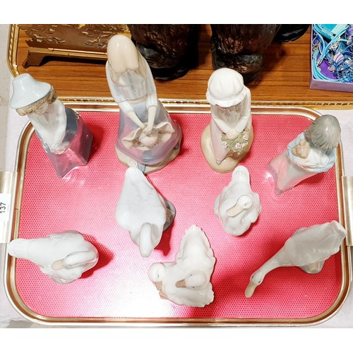 137 - Five Nao models of geese together with four Lladro style figures. No shipping. Arrange collection or... 