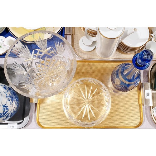 142 - Three pieces of cut crystal glassware including a blue overlay decanter, the tallest 12