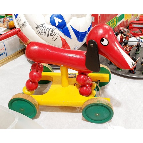 324 - A vintage Brio pull-along wooden dog, length 9