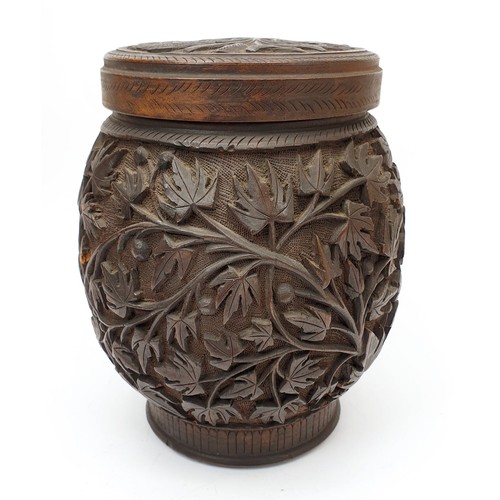 345 - A vintage carved wooden tobacco jar with metal lining, height 6.25