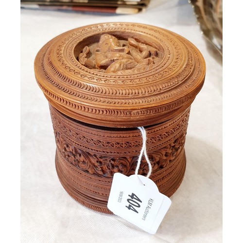 404 - A vintage intricately carved wooden box, the lid portraying Ganesh and the sides carved with foliage... 