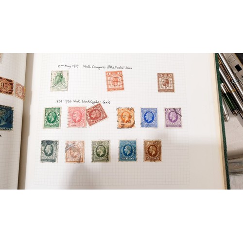 410 - Two stamp albums containing Victorian and later stamps including 14 Penny Reds and 4 Two Penny Blues... 