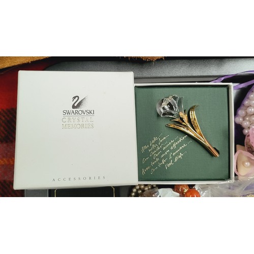 238 - A boxed Swarovski brooch and costume jewellery. UK shipping £14.