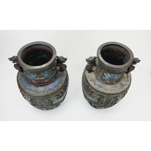 336 - A pair of early 20th century Japanese bronze vases with stylised relief cloisonné birds and cloud mo... 