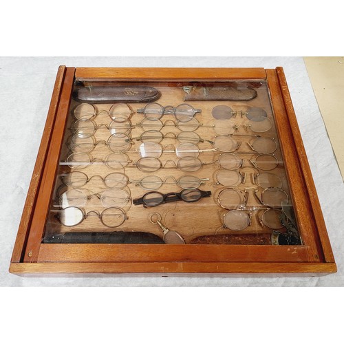 355 - A wooden cased display of antique and later spectacles and cases, 15.75