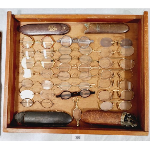 355 - A wooden cased display of antique and later spectacles and cases, 15.75