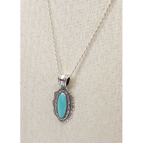 4 - A silver pendant set with turquoise on a silver chain. UK shipping £14.