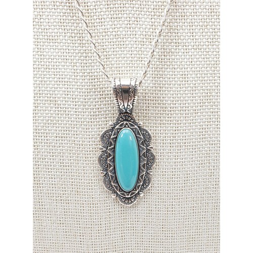 4 - A silver pendant set with turquoise on a silver chain. UK shipping £14.