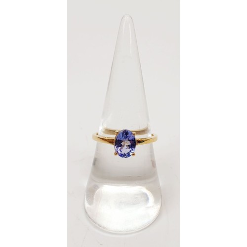 10 - A 9ct gold ring set with a AA tanzanite, size N/O, gross weight 1.8g. UK shipping £14.