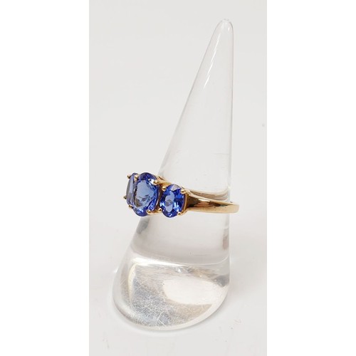 14 - A hallmarked 9ct gold ring set with tanzanite, size O/P, gross weight 3g. UK shipping £14.