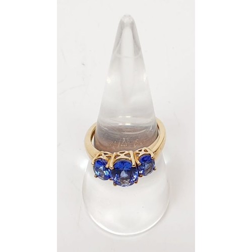 14 - A hallmarked 9ct gold ring set with tanzanite, size O/P, gross weight 3g. UK shipping £14.