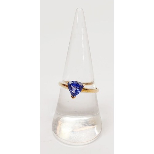 20 - A hallmarked 9ct gold triangular tanzanite solitaire ring, size O, gross weight 1.9g. UK shipping £1... 