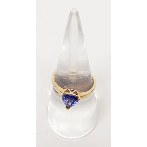 20 - A hallmarked 9ct gold triangular tanzanite solitaire ring, size O, gross weight 1.9g. UK shipping £1... 