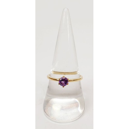 22 - A hallmarked 9ct gold amethyst solitaire ring, size Q, gross weight 1.5g. UK shipping £14.