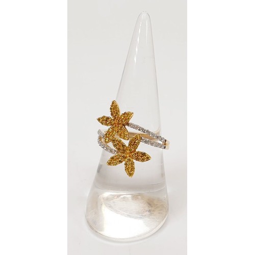 25 - A hallmarked 9ct gold yellow and white diamond flower ring, size O, gross weight 3.3g. UK shipping £... 