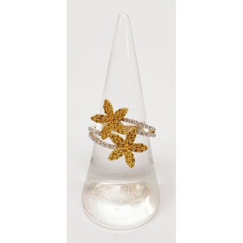 25 - A hallmarked 9ct gold yellow and white diamond flower ring, size O, gross weight 3.3g. UK shipping £... 