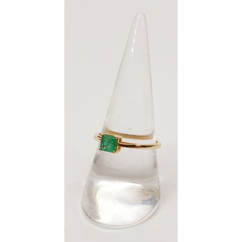 27 - A hallmarked 9ct gold emerald solitaire ring, size P/Q, gross weight 1.4g. UK shipping £14.