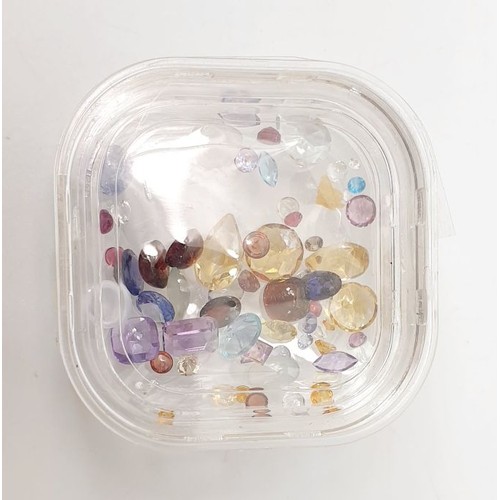 60 - A box of assorted small gem stones. UK shipping £14.