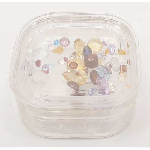 60 - A box of assorted small gem stones. UK shipping £14.