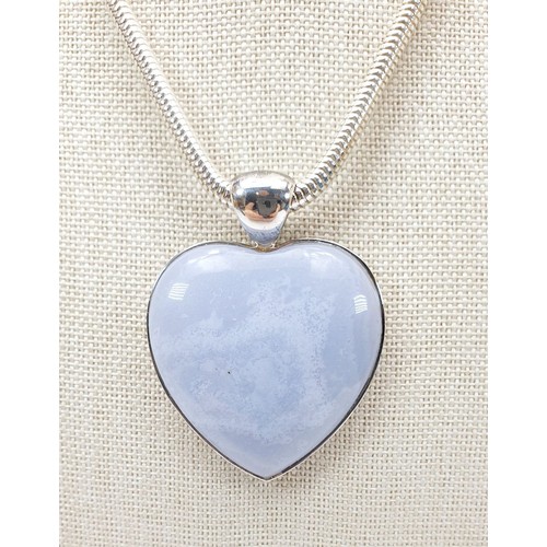 58 - A large silver stone set pendant on a silver chain. UK shipping £14.